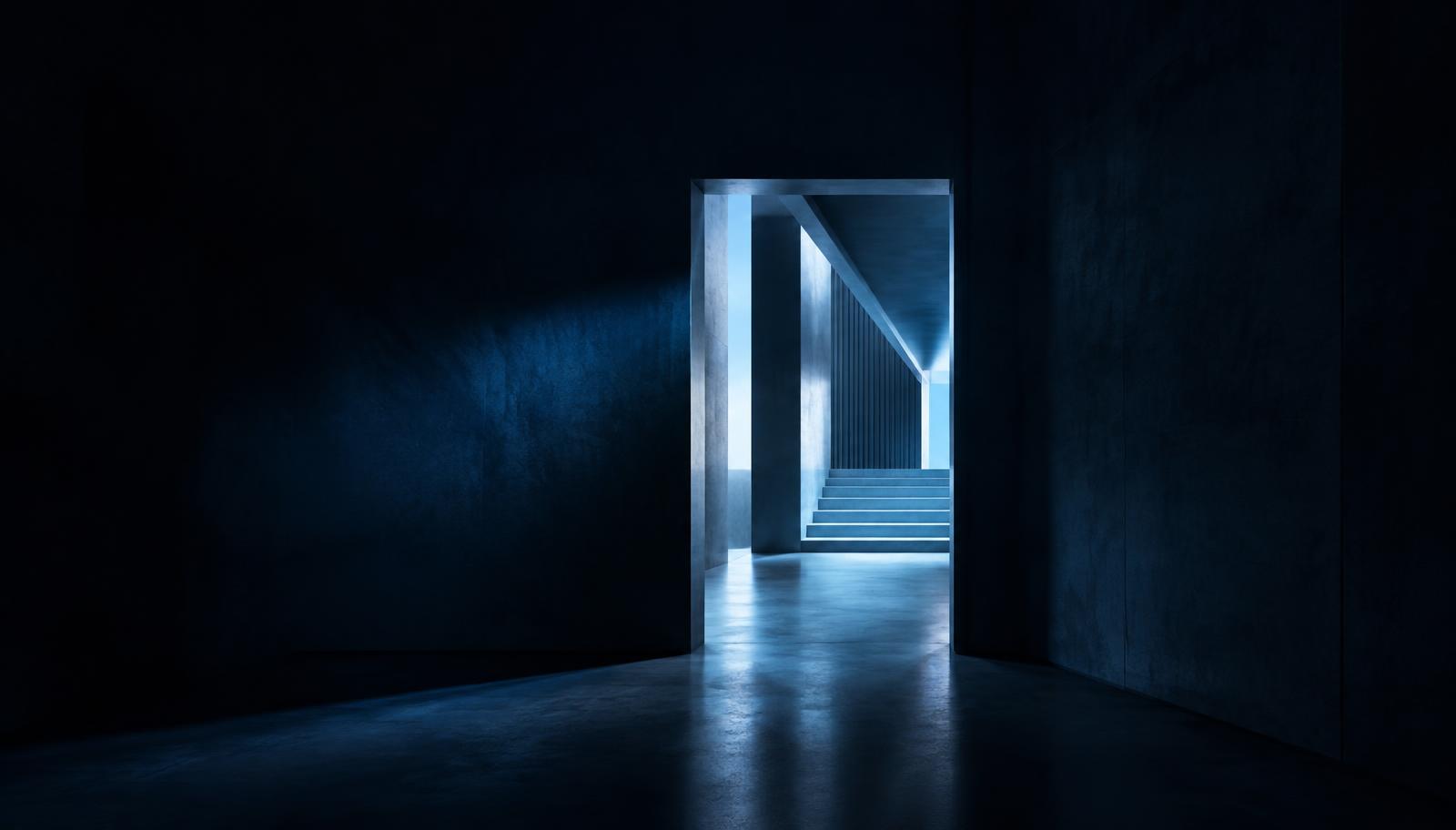 A lone illuminated doorway opening from a dark corridor into a structured architectural space, representing an advisor launching an independent SEC-registered firm